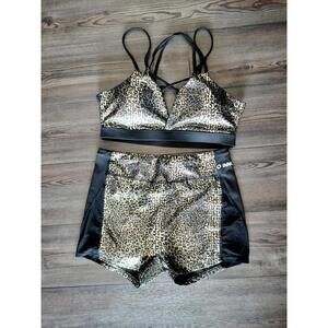 Black and gold activewear shorts and sports bra set